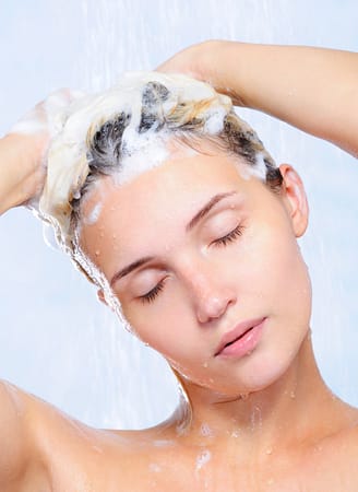 portrait-of-pretty-young-woman-washing-her-hair